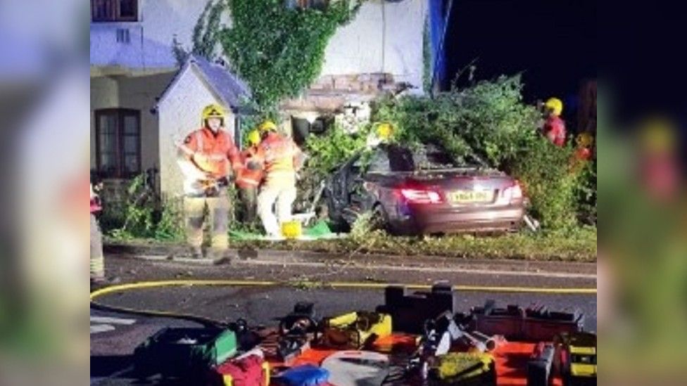 Road closure after car hits Beckford house BBC News