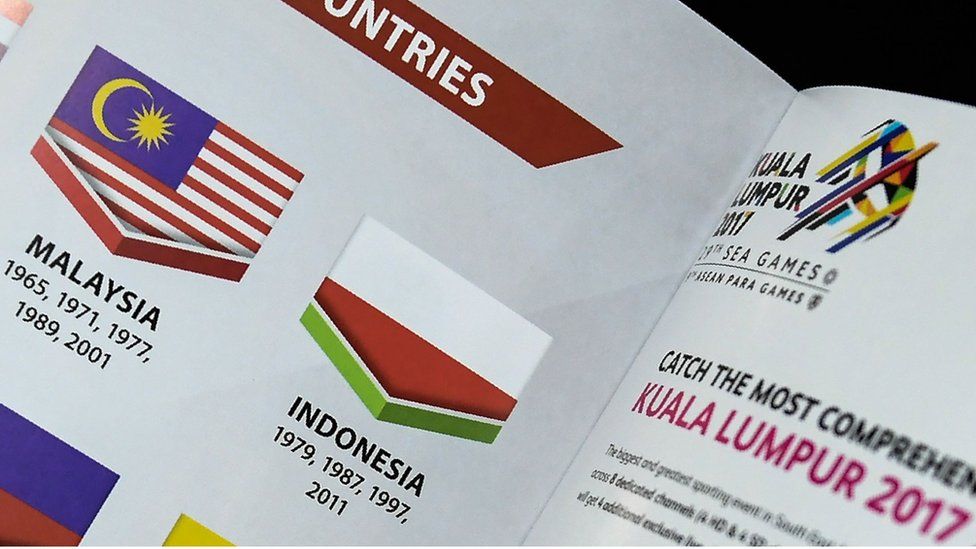 This photo illustration taken on 20 August 2017 shows the Indonesian flag printed upside-down in a copy of the souvenir magazine for the 29th Southeast Asian Games (SEA Games) in Kuala Lumpur.
