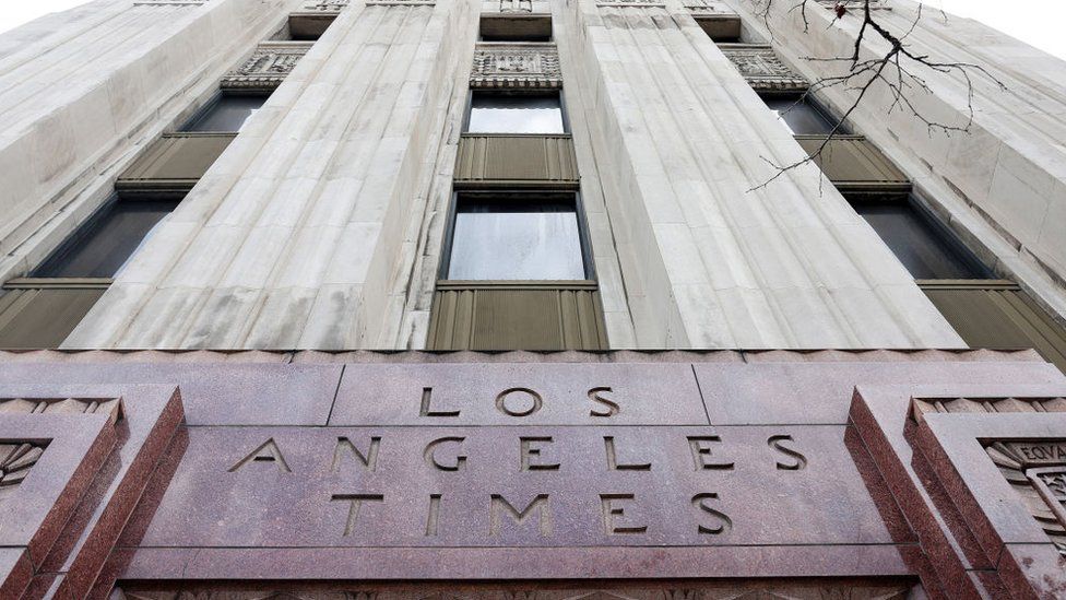 The Los Angeles Times name remains visible on the former LA Times downtown building after LA Times Guild members rallied outside City Hall against ‘significant’ imminent layoffs at the newspaper during a one-day walkout on January 19, 2024 in Los Angeles, California.