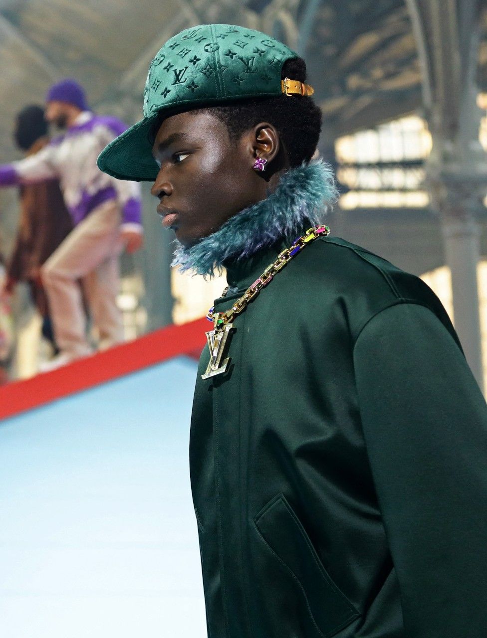 A model presents a creation by late designer Virgil Abloh as part of his Fall/Winter 2022 collection show for fashion house Louis Vuitton during Mens Fashion Week in Paris