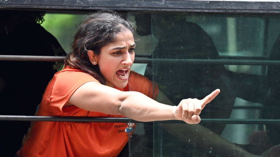 Sangeeta Phogat during wrestlers' protest march towards new Parliament building, on May 28, 2023 in New Delhi, India. The Delhi Police detained protesting wrestlers when they breached the security and tried to march towards the new parliament building.