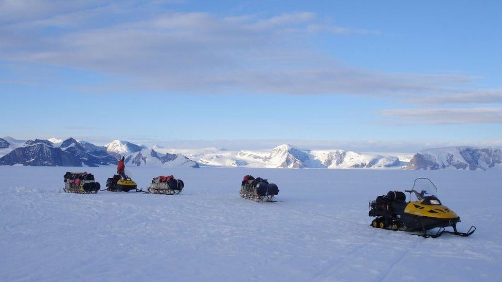 Catrin and other BAS field guides make their way around by skidoos, which can often become covered in snow