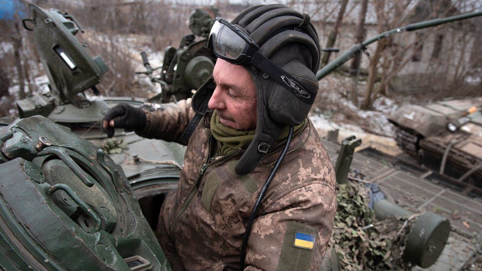 Ukraine soldier getting out of military tank near Slovyansk.