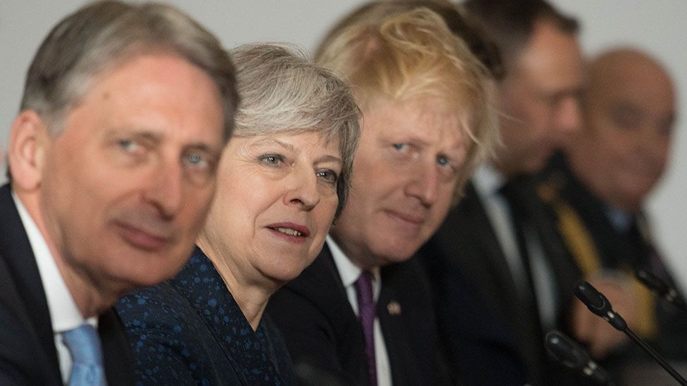 Chancellor Philip Hammond, Prime Minister Theresa May and Foreign Secretary Boris Johnson during UK-France summit talks at the Royal Military Academy Sandhurst on January 18, 2018