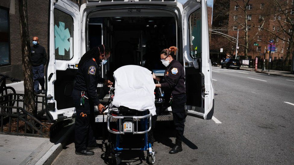 Ambulance workers clean a gurney at Mount Sinai Hospital amid the coronavirus pandemic on April 01, 2020 in New York City