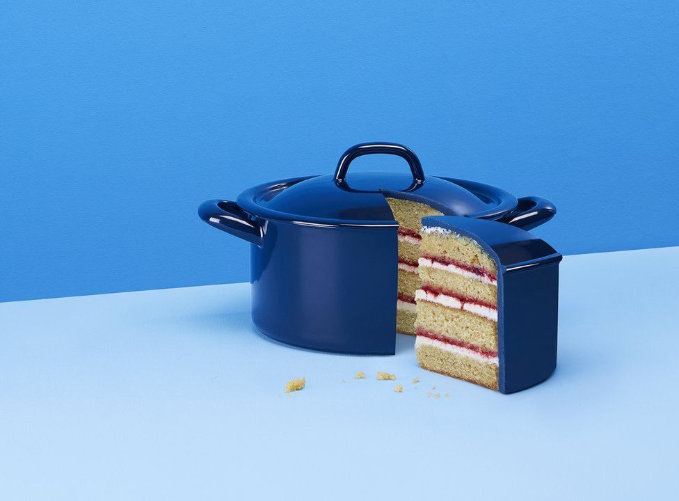 A cake decorated to look like a blue cooking pot