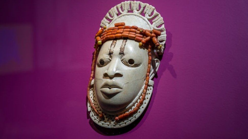A 19th-century ivory, ceremonial hip mask in honour of Queen Mother Idia and looted by British soldiers from the Kingdom of Benin in 1897 hangs on display in the "Where Is Africa" exhibition at the Linden Museum on May 05, 2021 in Stuttgart, Germany