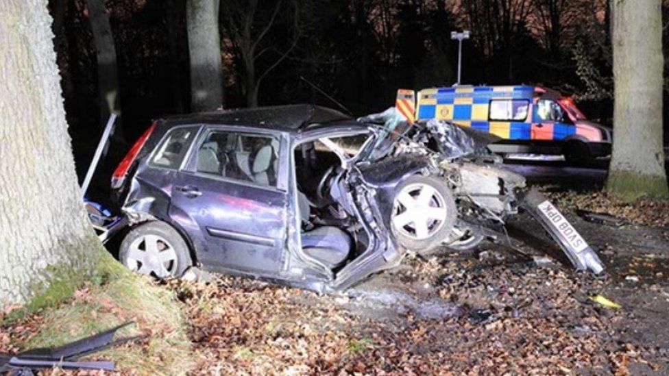 Car racer shot before crashing into tree