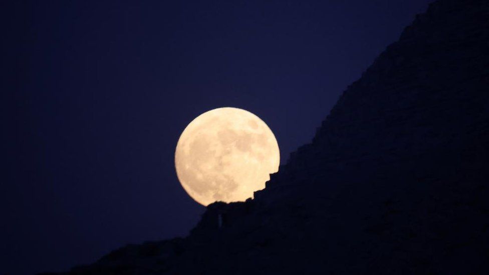 "Blue Moon" rises behind the Pyramids of Giza in Egypt, August 30