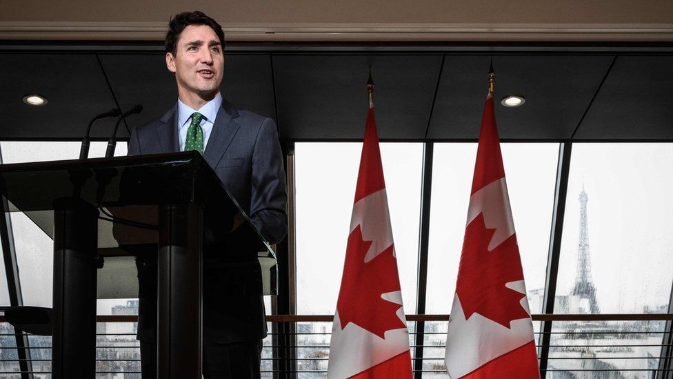 Justin Trudeau speaks to reporters at the Canadian embassy in Paris