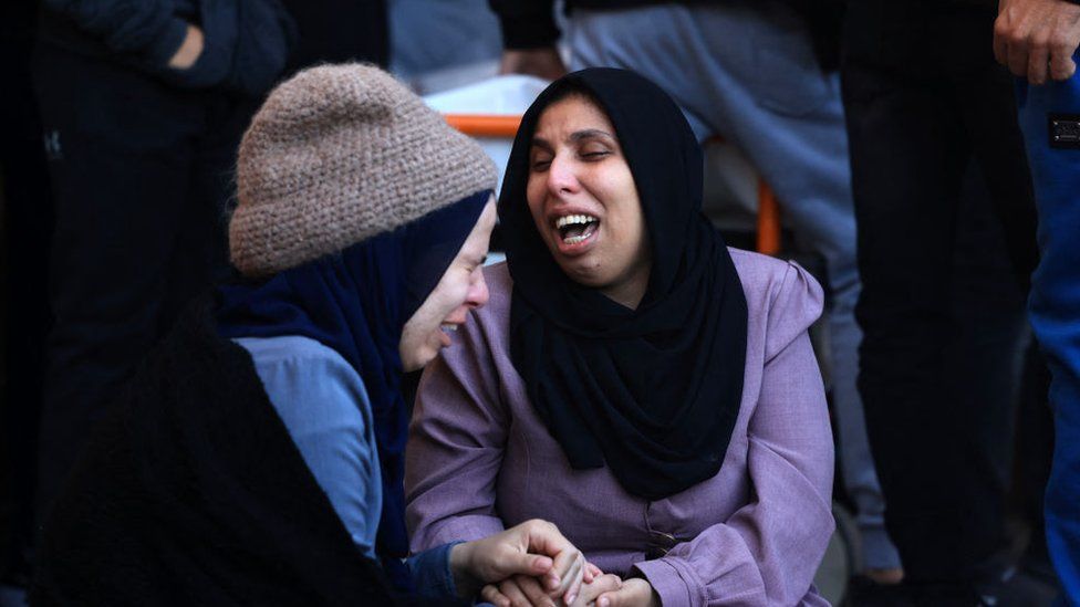 A woman mourns the death of her husband at a morgue in the Nasser medical centre in Kahn Younis, southern Gaza