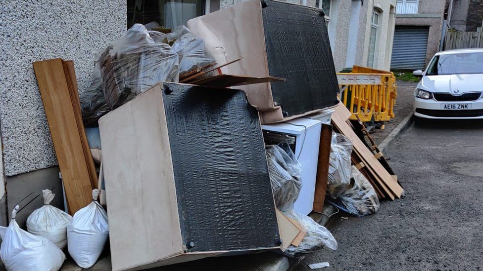 Ruined furniture piled up in the street