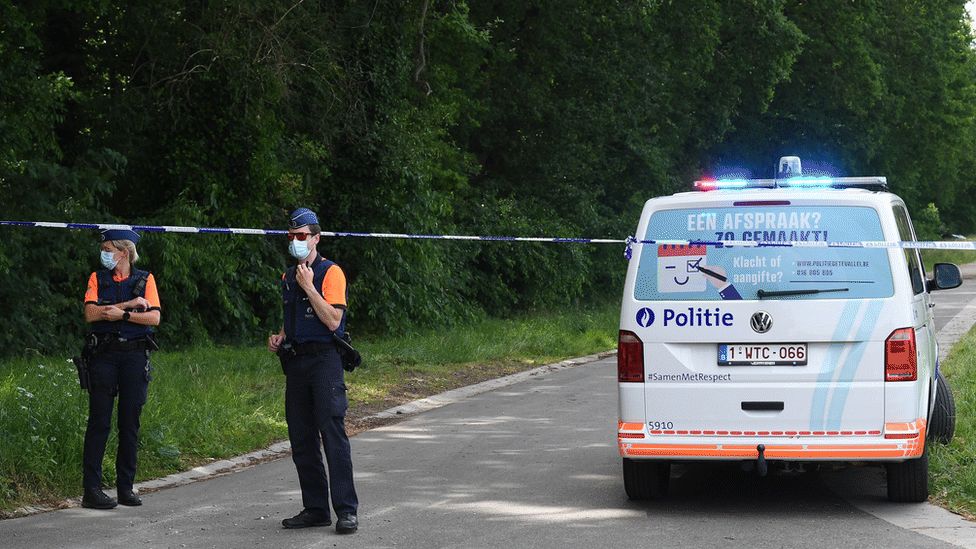 Belgian police cordons off an area where a body was found