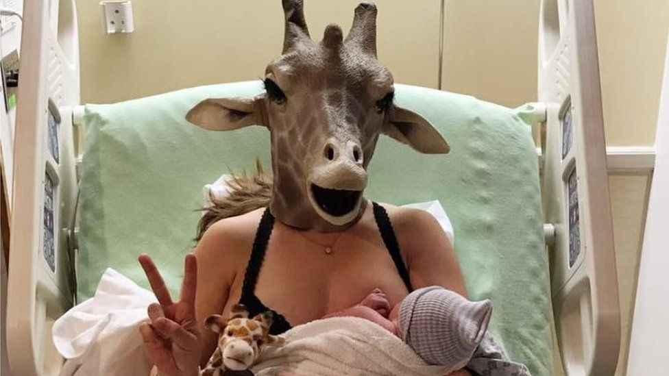 Erin Dietrich, as April the giraffe, with her new son, Porter Lane