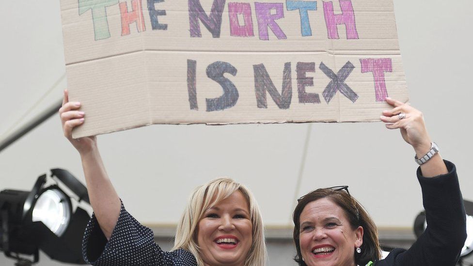 Sinn Féin's Michelle O'Neill and Mary Lou McDonald hold placard saying 'The north is next'