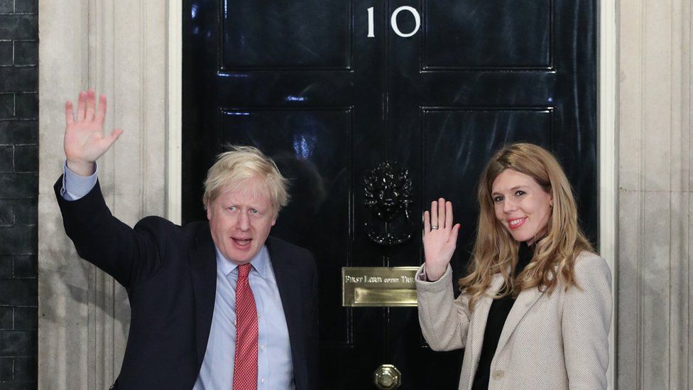 Prime Minister Boris Johnson and his girlfriend Carrie Symonds arrive in Downing Street after the Conservative Party was returned to power in the General Election with an increased majority.