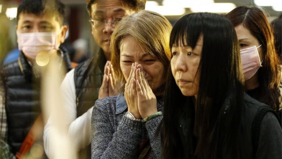 Mourners at the memorial service in Tainan
