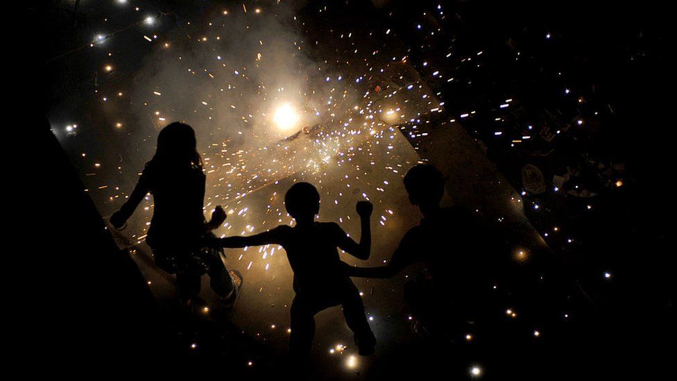 Indian children light fireworks in New Delhi