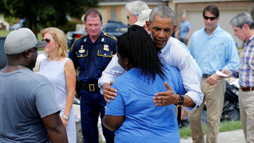 Obama comforts woman