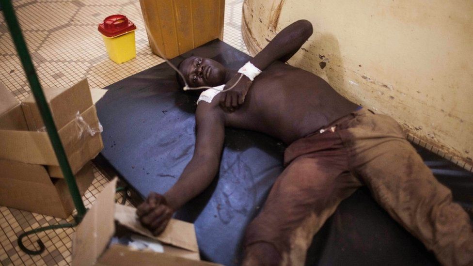 A Burkina Faso protester that was injured during clashes, receives treatment in hospital in Ouagadougou, Burkina Faso, Thursday, Sept. 17, 2015