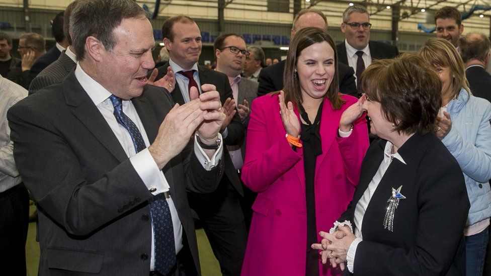 Diane Dodds being applauded by her husband Nigel Dodds and their daughter Robyn