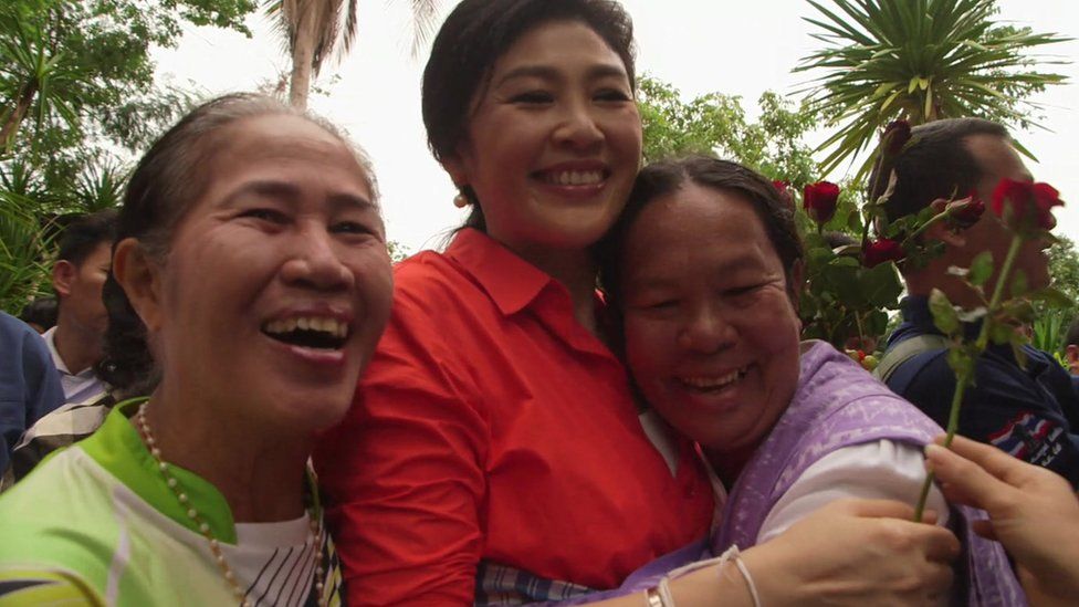Thai women hug former Prime Minister Yingluck Shinawatra
