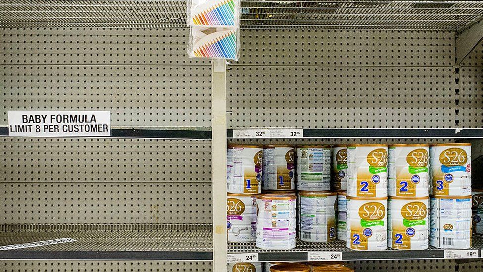 Shelves almost empty of baby formula with signs warning customers that they are limited to eight cans per customer at a large Sydney supermarket on November 12, 2015