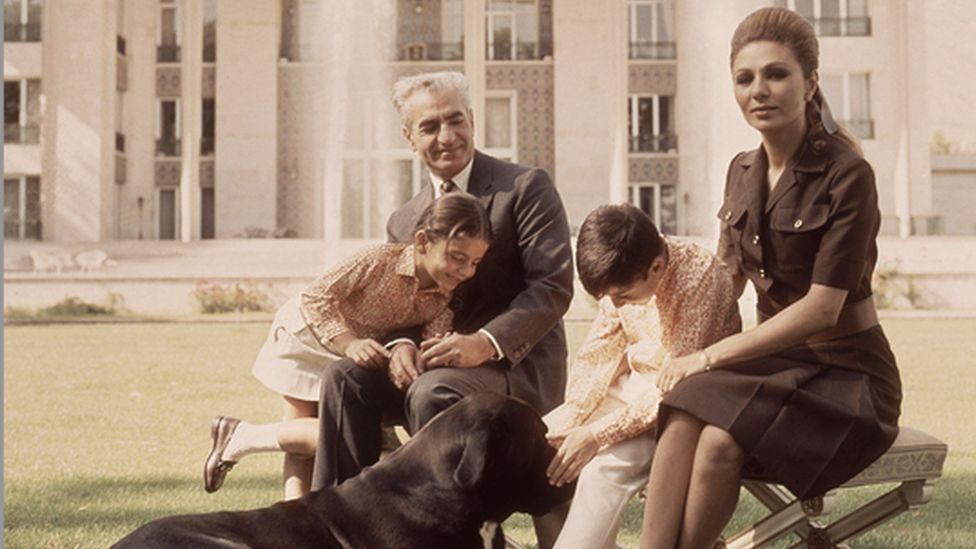 A picture of Iran's royal family with a dog