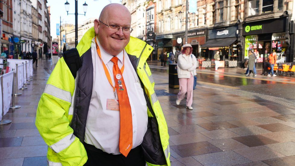 Bus driver Paul Davies in a high vis jacket.