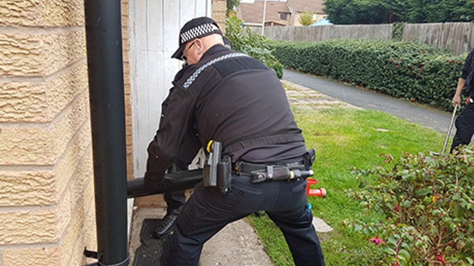 Police officer during a raid