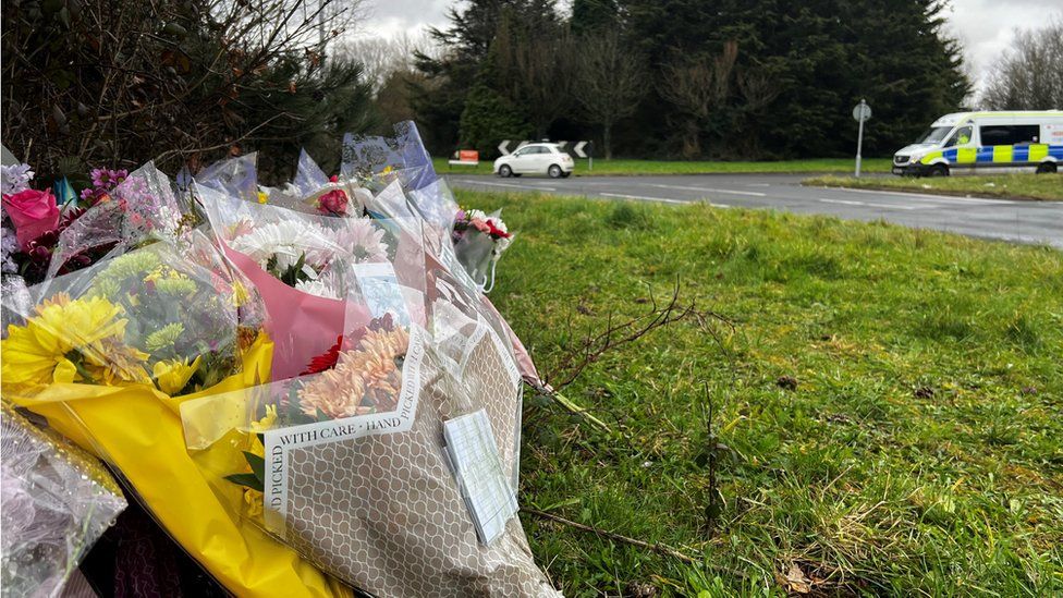 Floral tributes have been left at the site of the crash