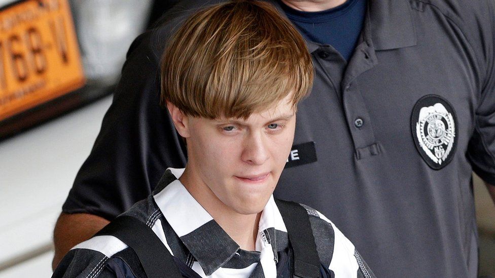 Dylann Roof, wearing a bullet proof vest, is escorted from the Cleveland County Courthouse