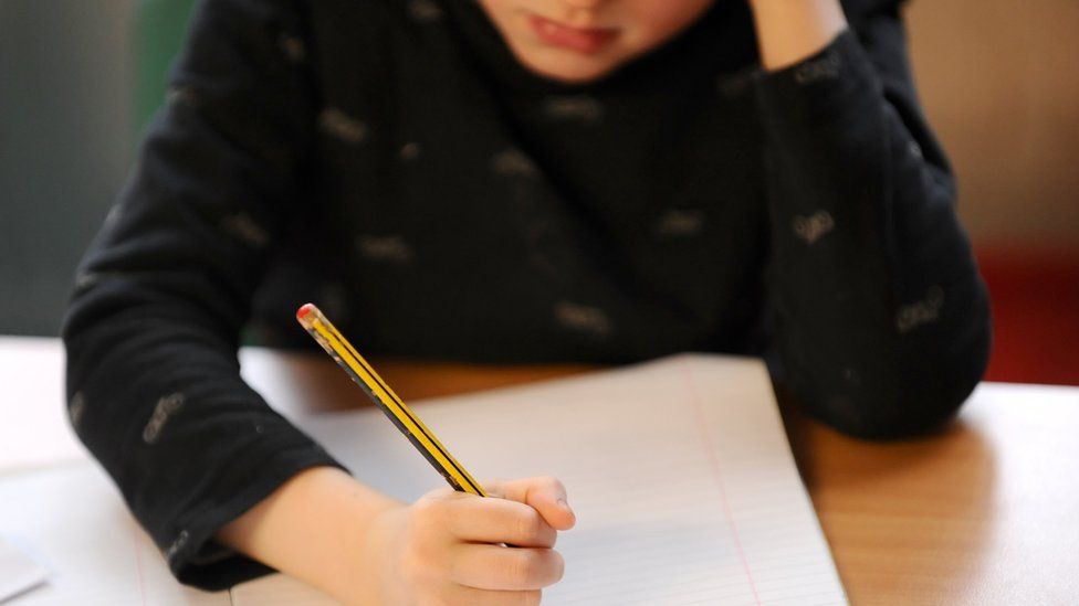 Girl writing in a notebook