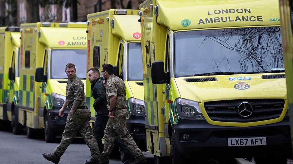 Military personnel and ambulance worker amid the strike on Wednesday