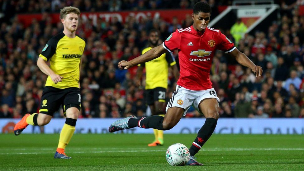 Marcus Rashford of Manchester United scores his sides first goal during the Carabao Cup Third Round match between Manchester United and Burton Albion at Old Trafford on September 20,