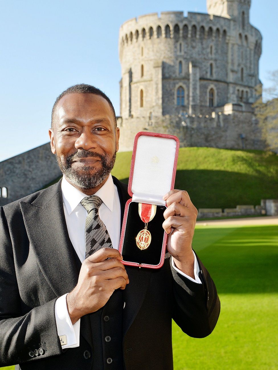 Sir Lenny Henry after receiving a Knighthood from Queen Elizabeth II during an Investiture ceremony at Windsor Castle on December 4, 2015 in Windsor, England