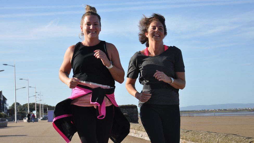 Charlotte Milsom and Faye Chambers running on the seafront