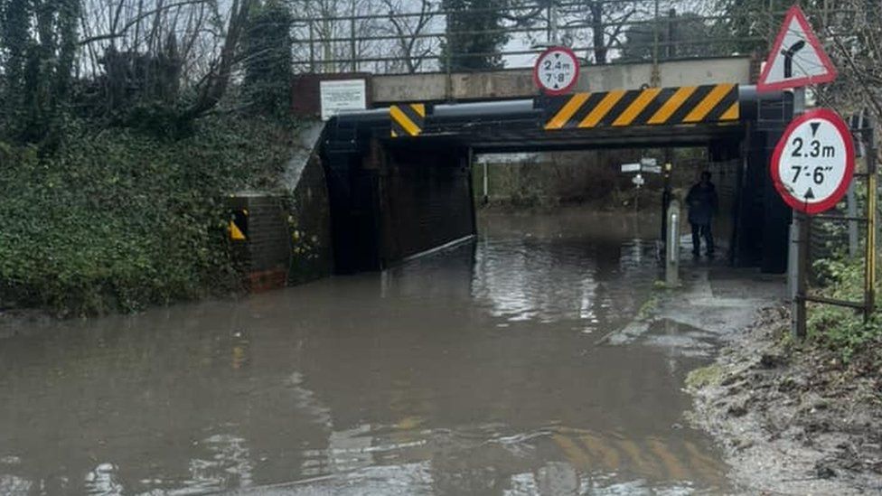 A flood road beneath a railway bridge