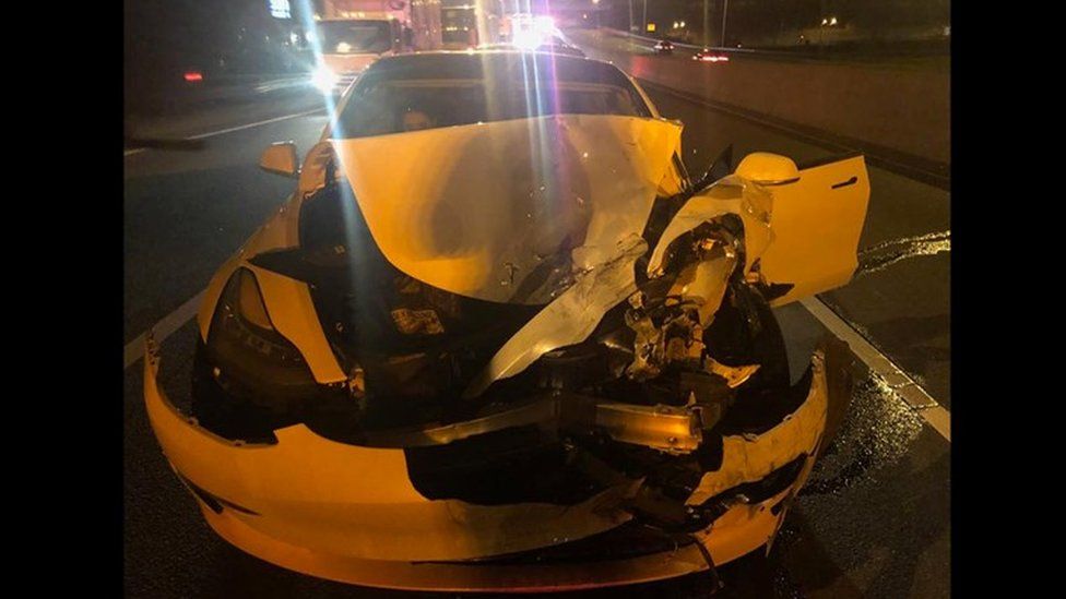 A Tesla Model 3 photographed from the front following a crash.