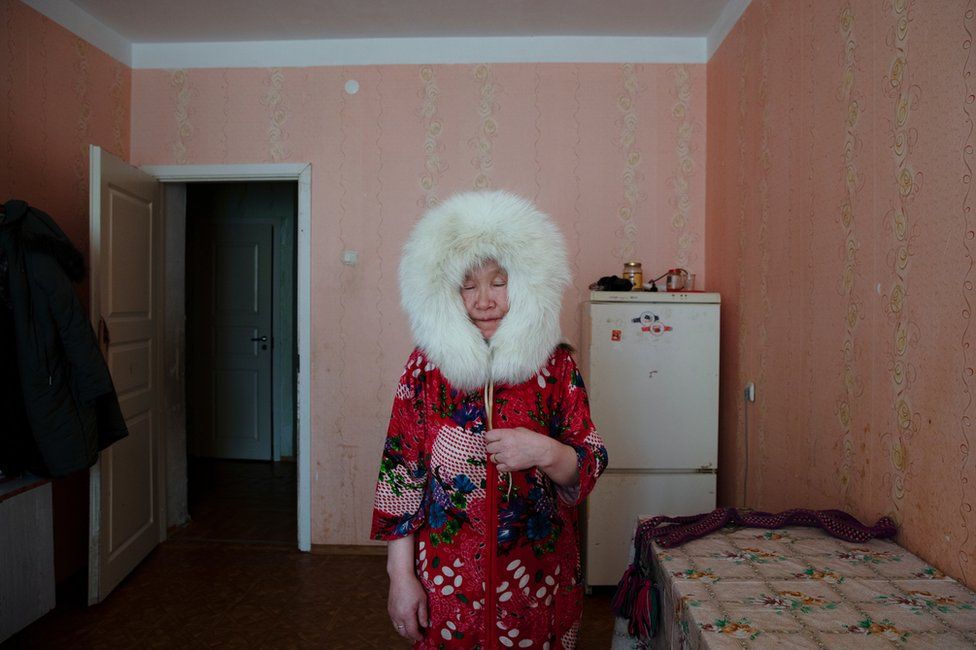 Pudani Audi (born.1948) in her apartment. Yar-Sale village, Yamal Peninsula, Siberia, Russia.