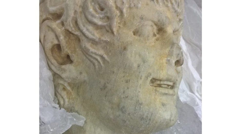 The head of a sculpture that was seized in the operation