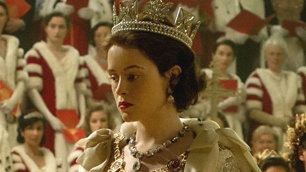 Claire Foy playing the Queen at her coronation in The Crown