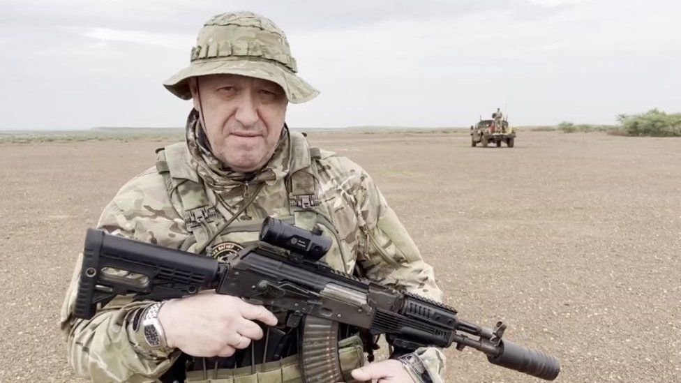 Yevgeny Prigozhin poses with an battle  rifle. File photo