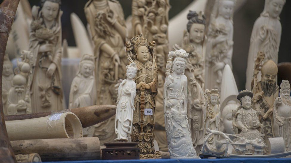 Carved ivory is shown to the media before being destroyed in Beijing on 29 May 2015