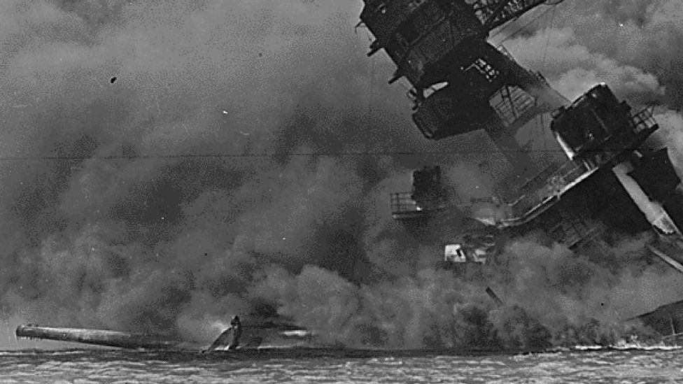 A view of the USS Arizona burning after the Japanese air attacks on Pearl Harbor in 1941