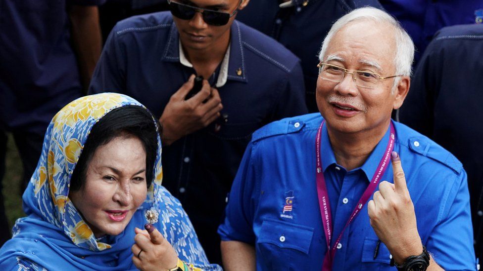 Malaysia"s Prime Minister Najib Razak of Barisan Nasional (National Front) and his wife Rosmah Mansor