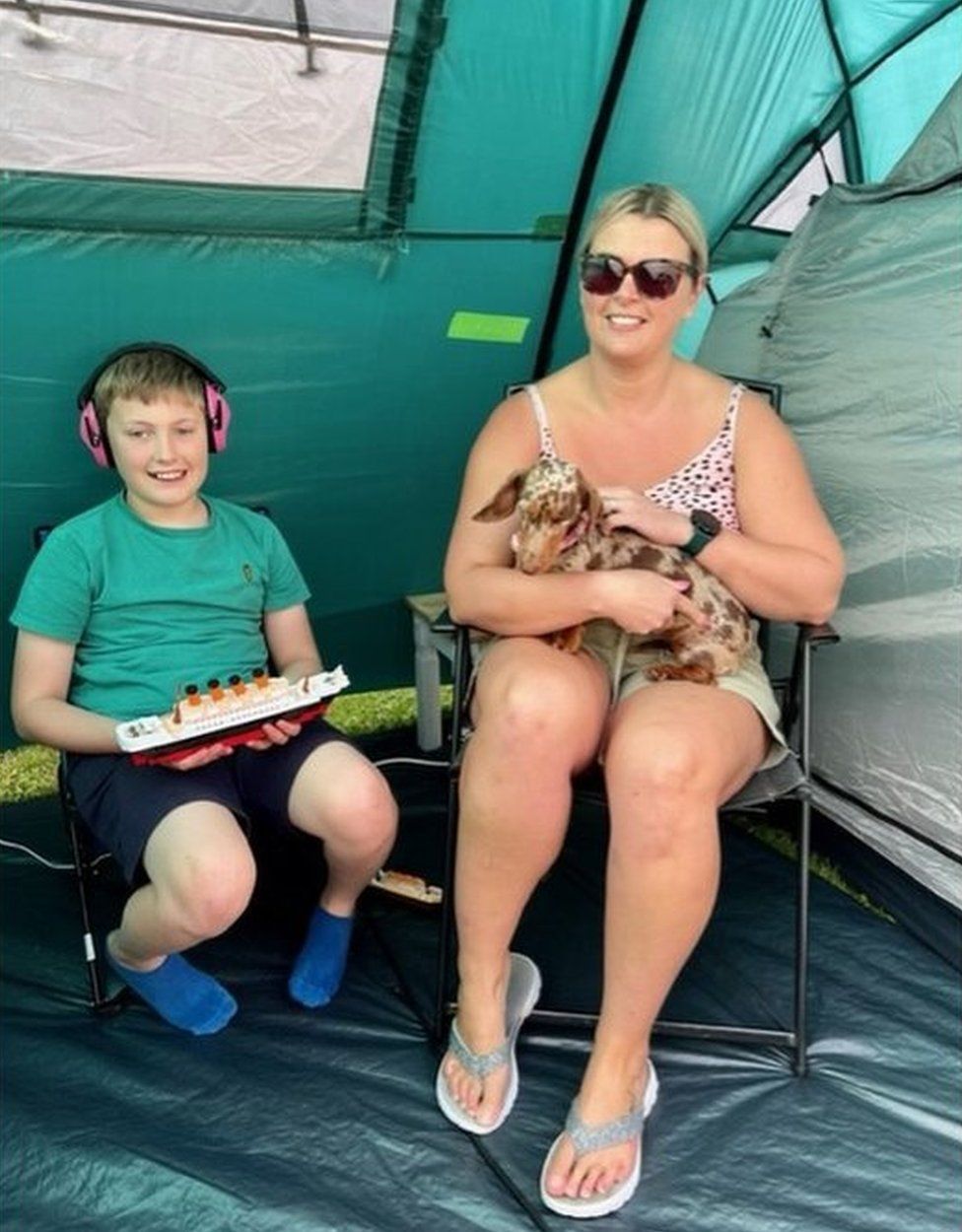 Kai, his mum and their miniature sausage dog, Bea