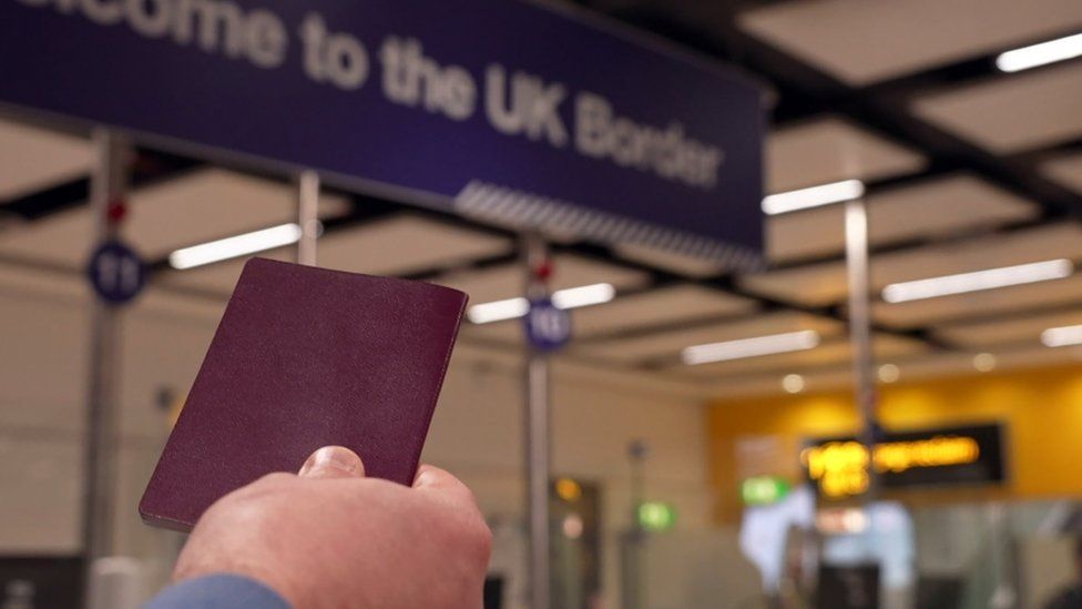 Person holding passport