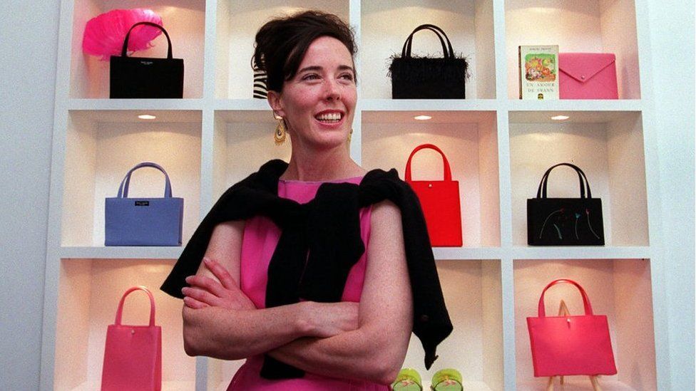 The fashion designer photographed amongst her handbags in 1999