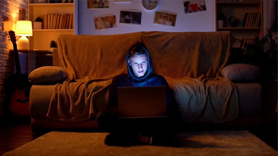 Teen boy on laptop